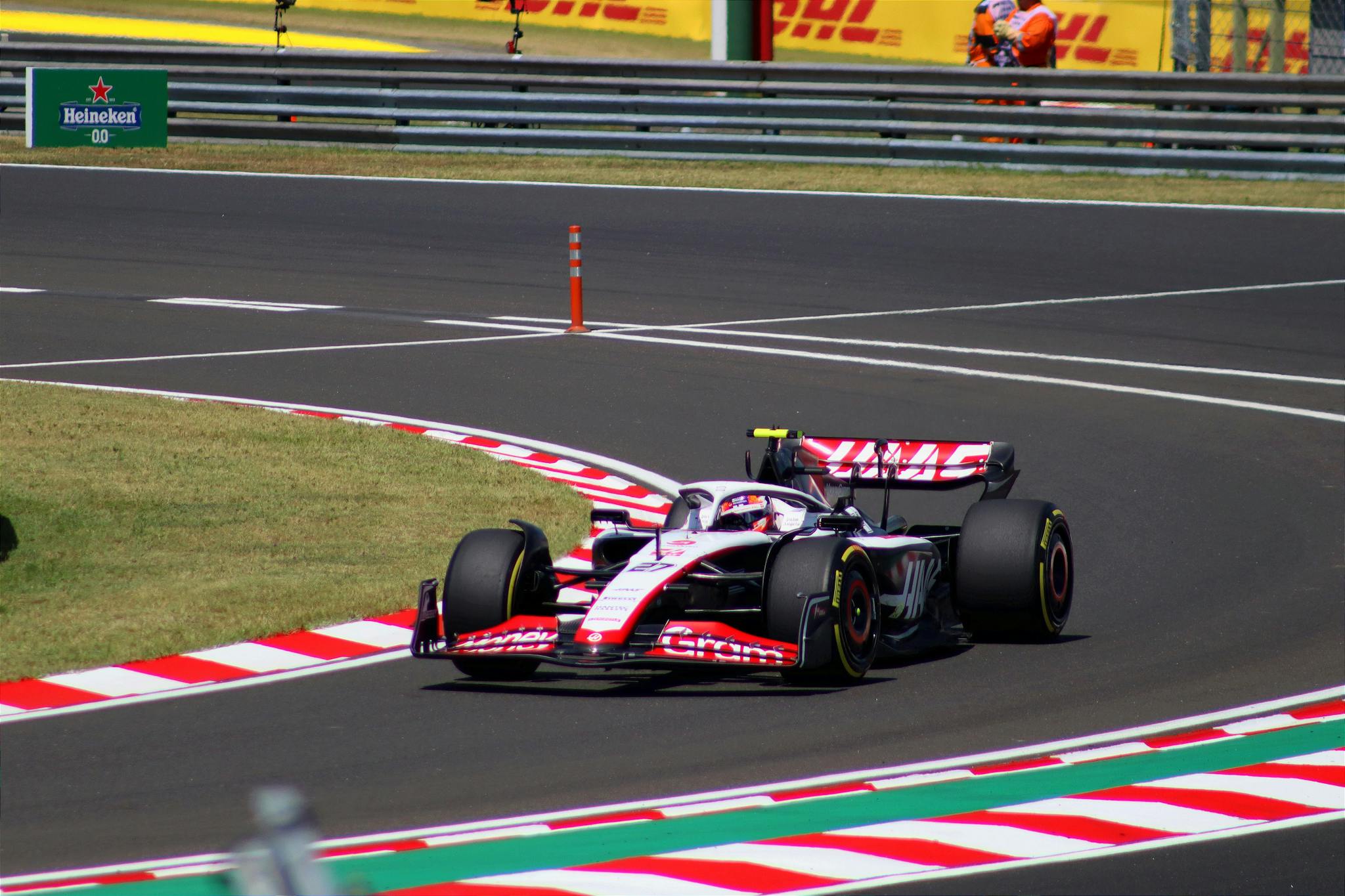 Dynamic shot of a Formula 1 car speeding around a corner at Hungaroring, Mogyoród.